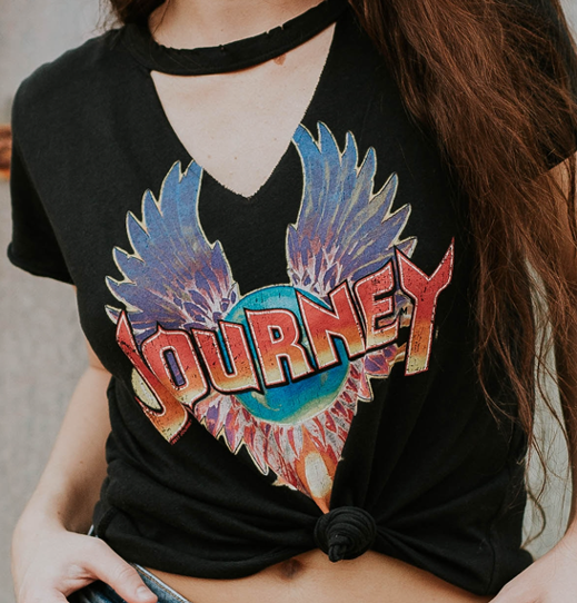 Direct to film colourful journey graphic on black shirt on person.