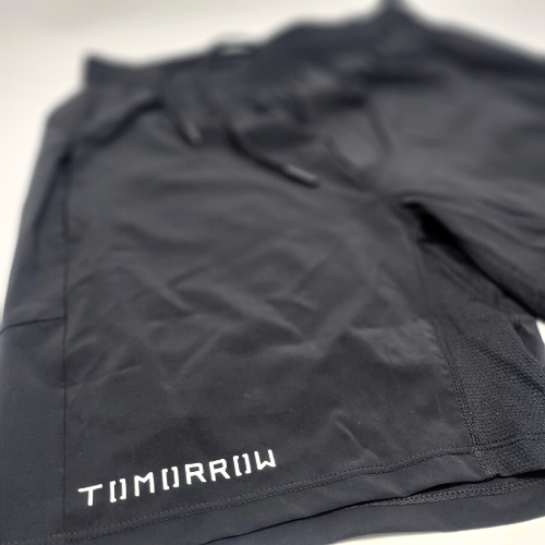 Tomorrow white vinyl on black shorts on white background.